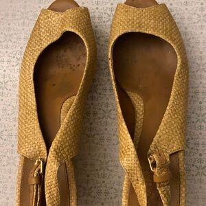 Tory Burch straw wedge open toed shoes.